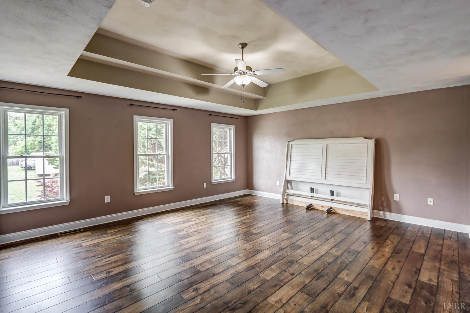 1057 Old Trail Road Forest, VA 24551 - Photo 27 of 49 a view of empty room with wooden floor and fan
