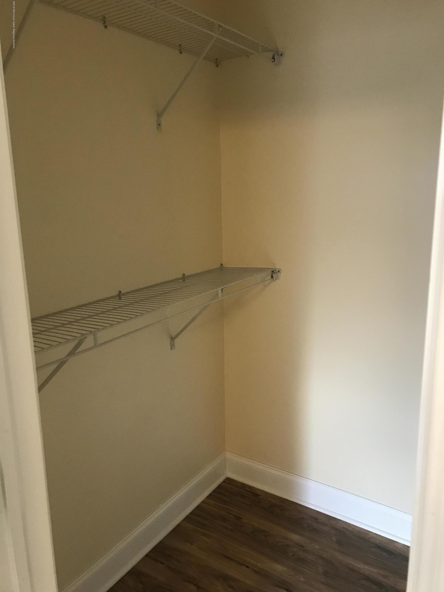 9 Swan Road, Unit 1000 Howell, NJ 07731 - Photo 11 of 13 a view of a room with racks on the wall