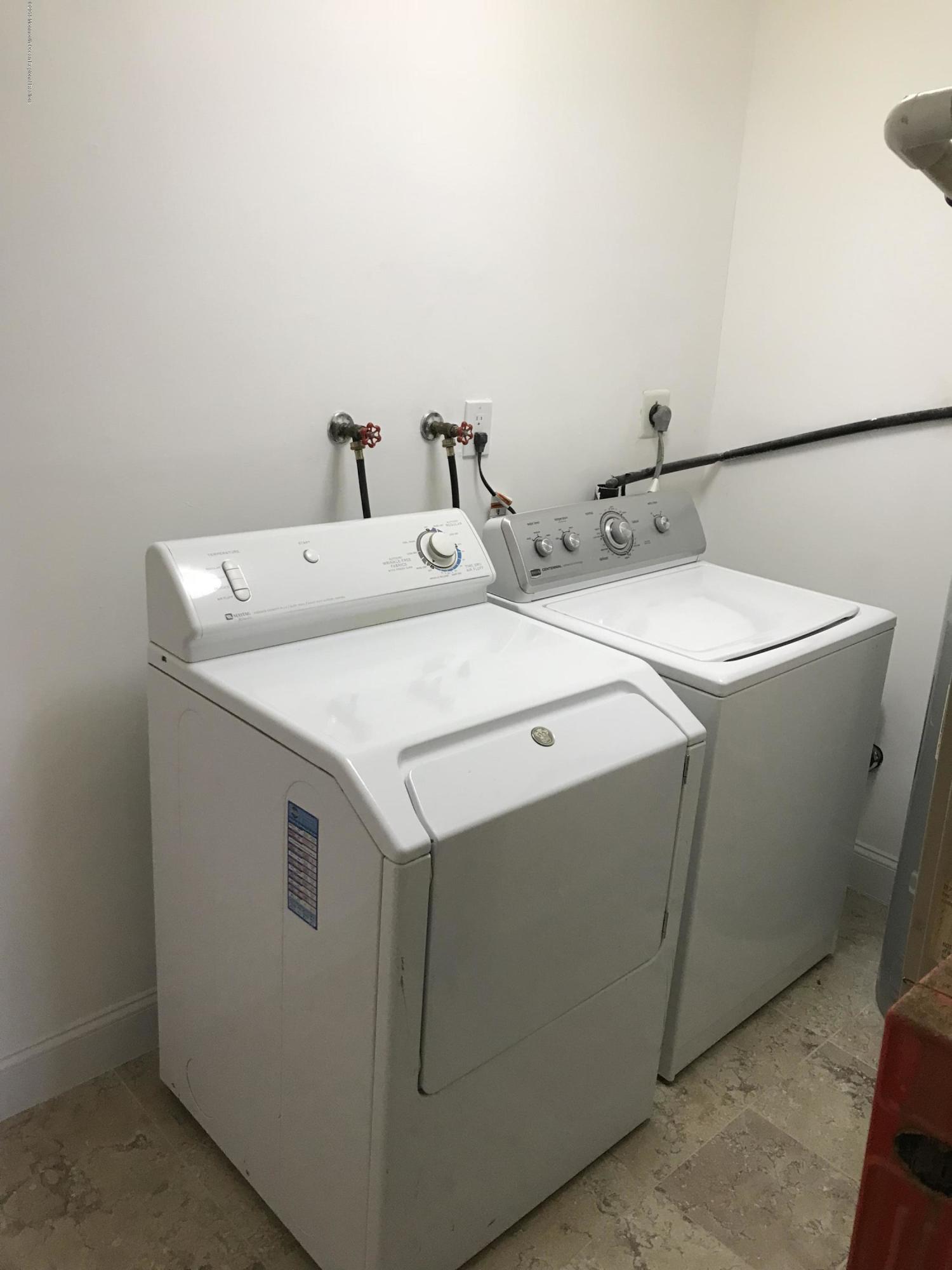 9 Swan Road, Unit 1000 Howell, NJ 07731 - Photo 12 of 13 a utility room with dryer and washer