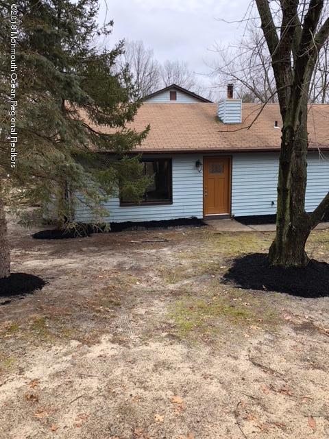 9 Swan Road, Unit 1000 Howell, NJ 07731 - Photo 13 of 13 a front view of a house with a yard