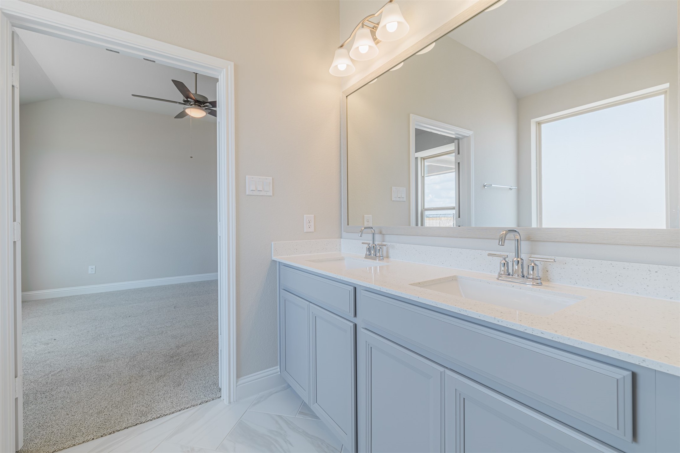 12611 White Pelican Court Cypress, TX 77433 - Photo 18 of 24 a bathroom with a sink and a mirror