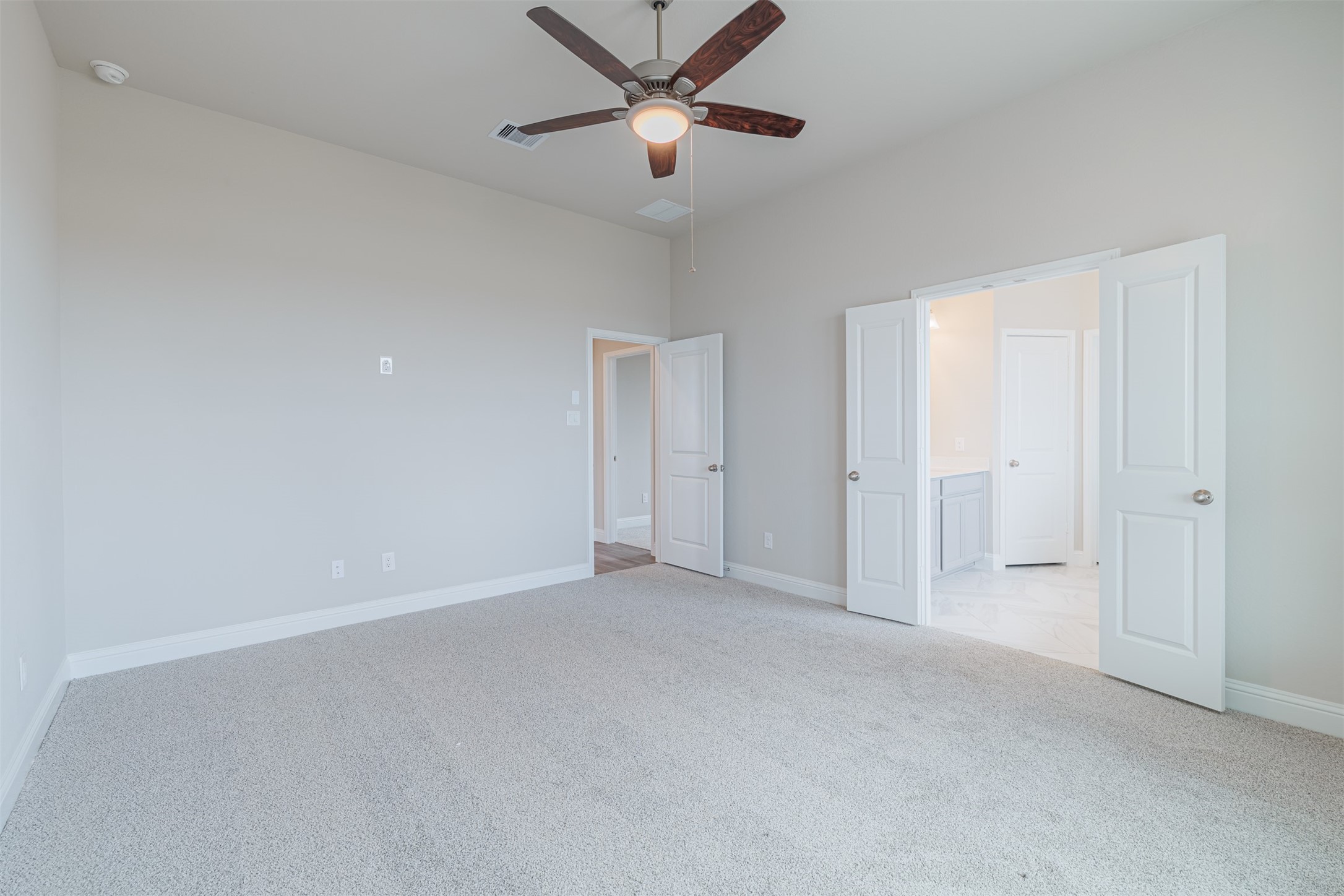 12611 White Pelican Court Cypress, TX 77433 - Photo 19 of 24 a view of an empty room and a ceiling fan