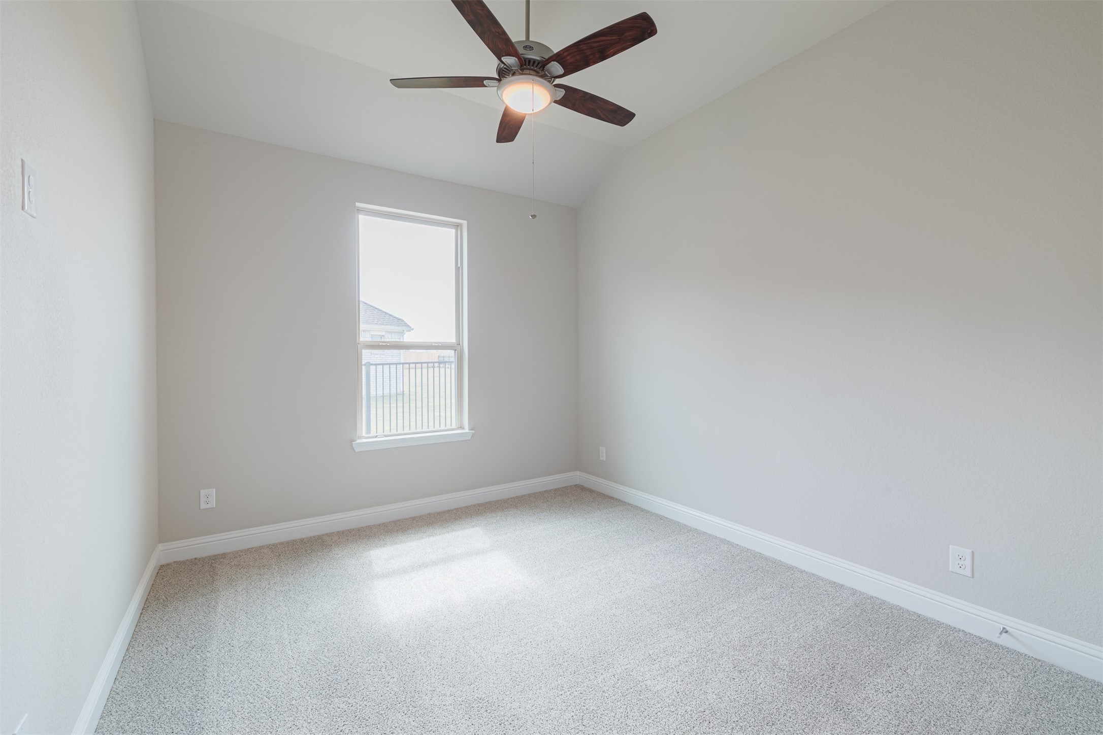 12611 White Pelican Court Cypress, TX 77433 - Photo 22 of 24 an empty room with a window and a fan