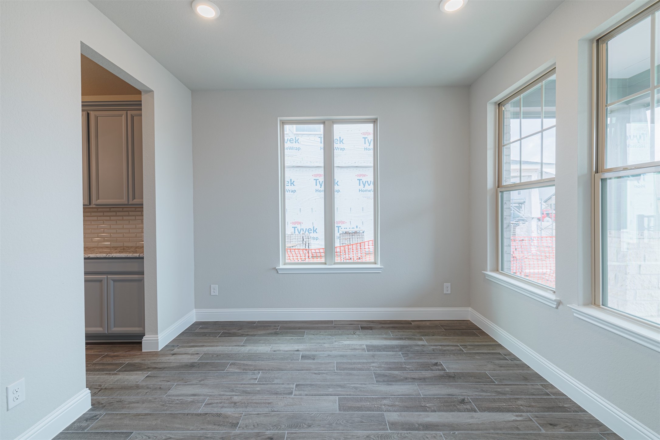 12611 White Pelican Court Cypress, TX 77433 - Photo 6 of 24 an empty room with wooden floor and windows