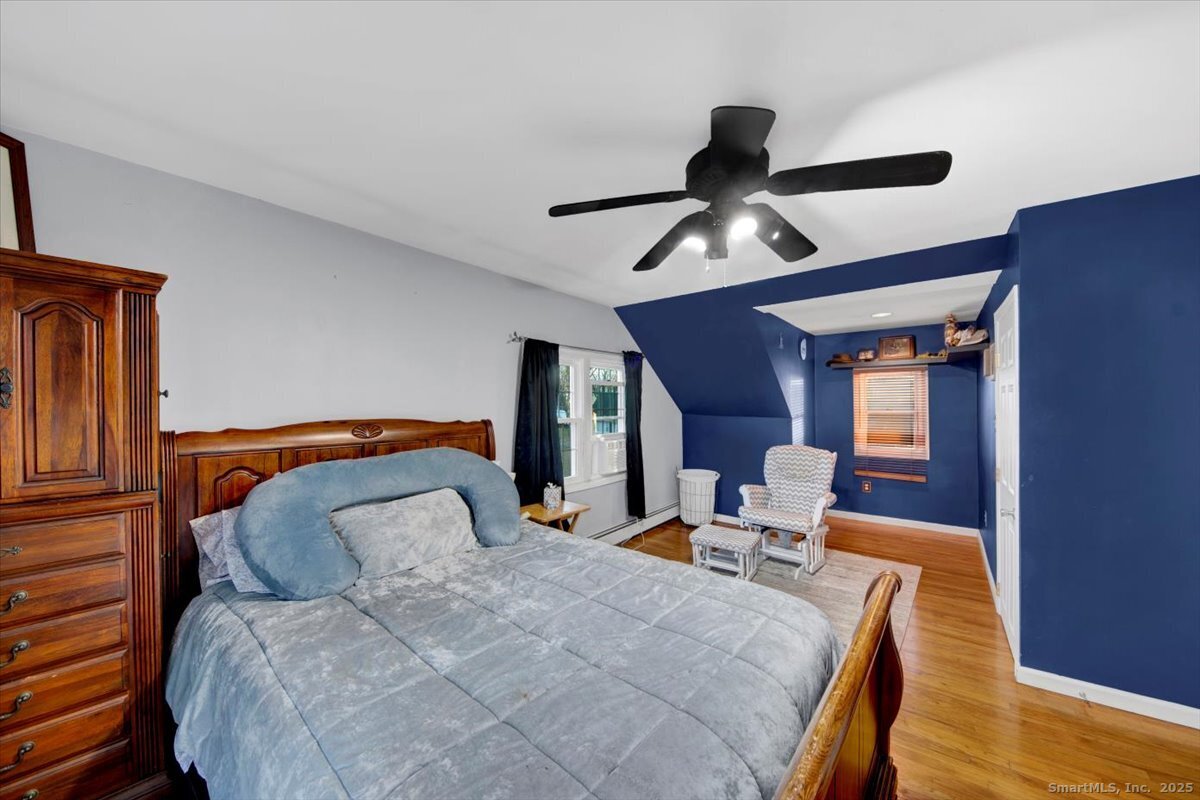 65 Clearview Drive Bridgeport, CT 06606 - Photo 11 of 25 a bedroom with bed and wooden floor