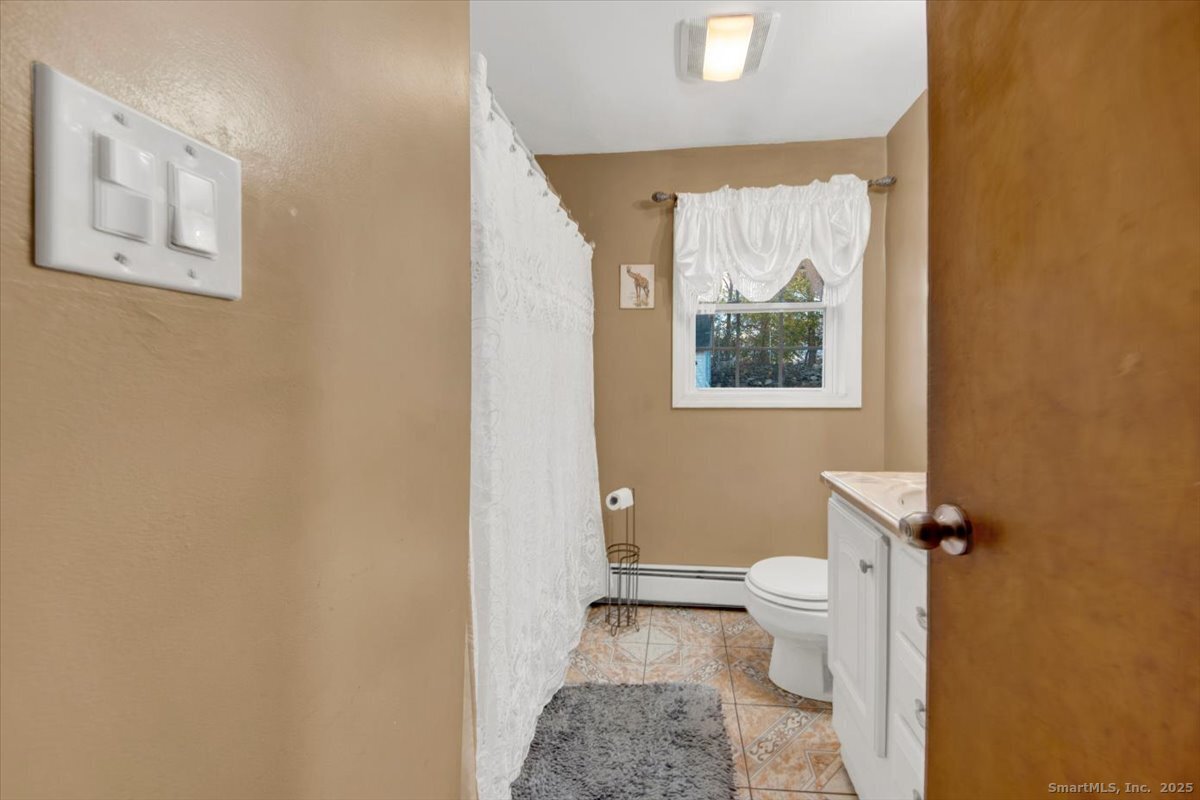 65 Clearview Drive Bridgeport, CT 06606 - Photo 12 of 25 a bathroom with a toilet sink and tub