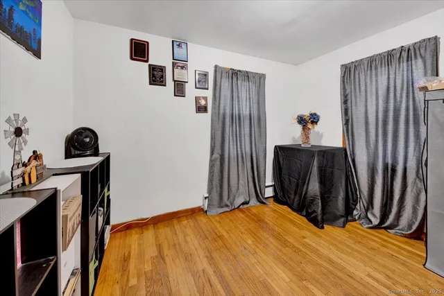 a bed room with a bed and a chair