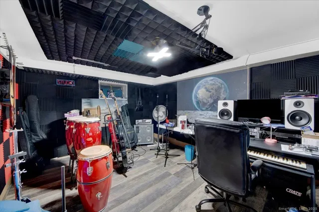 a living room with furniture ceiling fan and a rug