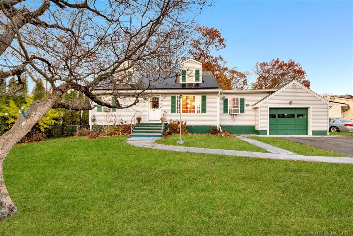 65 Clearview Drive Bridgeport, CT 06606 - Photo 2 of 25 a front view of house with yard and green space