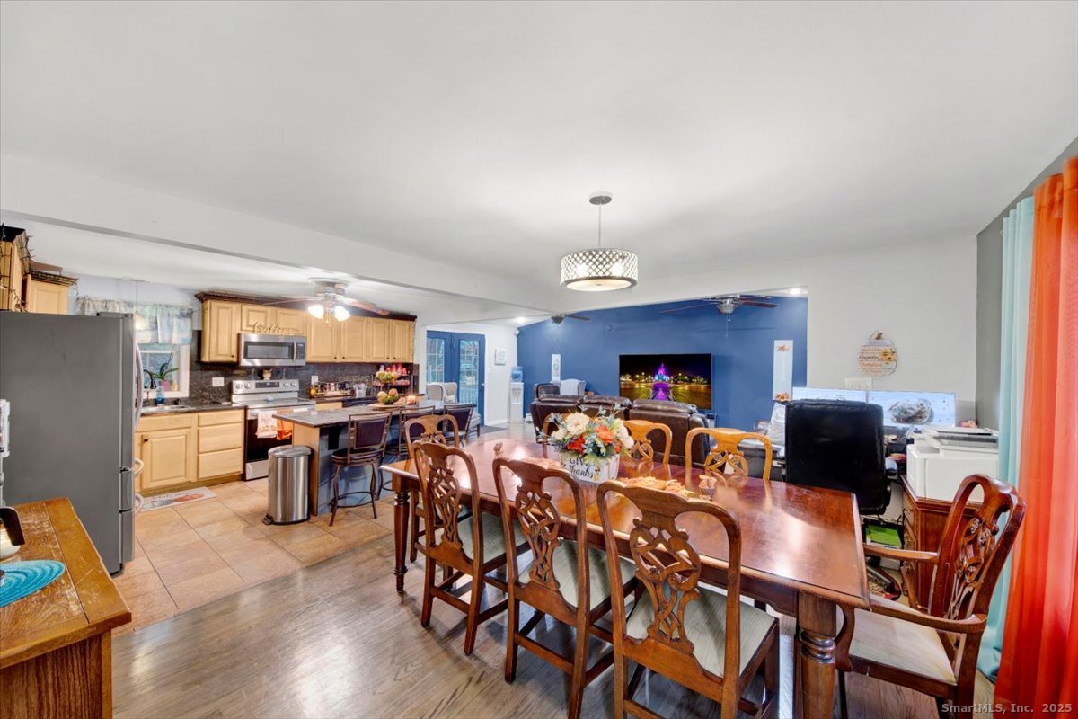 65 Clearview Drive Bridgeport, CT 06606 - Photo 22 of 25 a view of a dining room with furniture and wooden floor