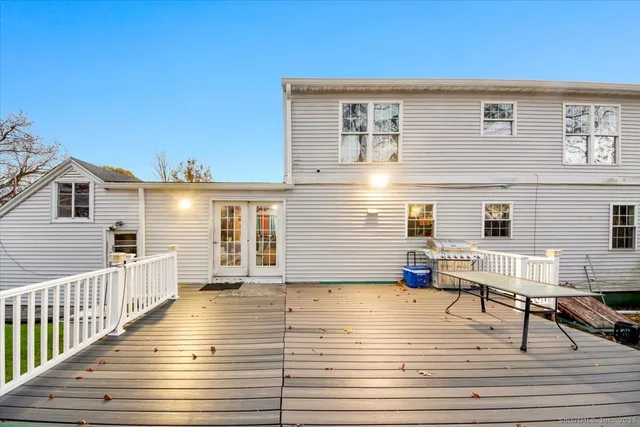 a view of a house with wooden deck