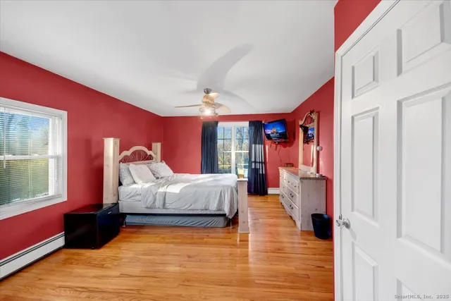 a bed room with a bed and a window