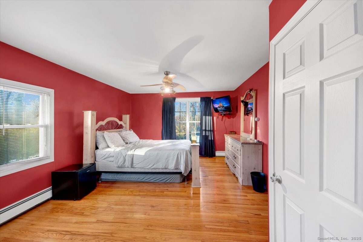 65 Clearview Drive Bridgeport, CT 06606 - Photo 7 of 25 a bed room with a bed and a window