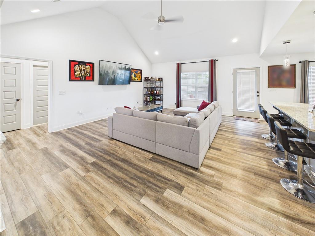 52 Owens Road Fort Mitchell, AL 36856 - Photo 7 of 29 Vaulted ceiling living area featuring wood-finish flooring, recessed lighting, and a ceiling fan