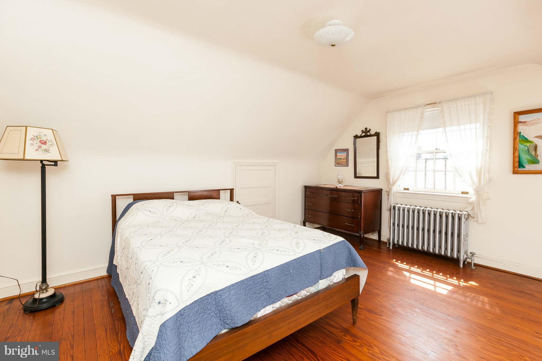 321 Tuscany Road Baltimore, MD 21210 - Photo 22 of 30 a bedroom with a bed and a window