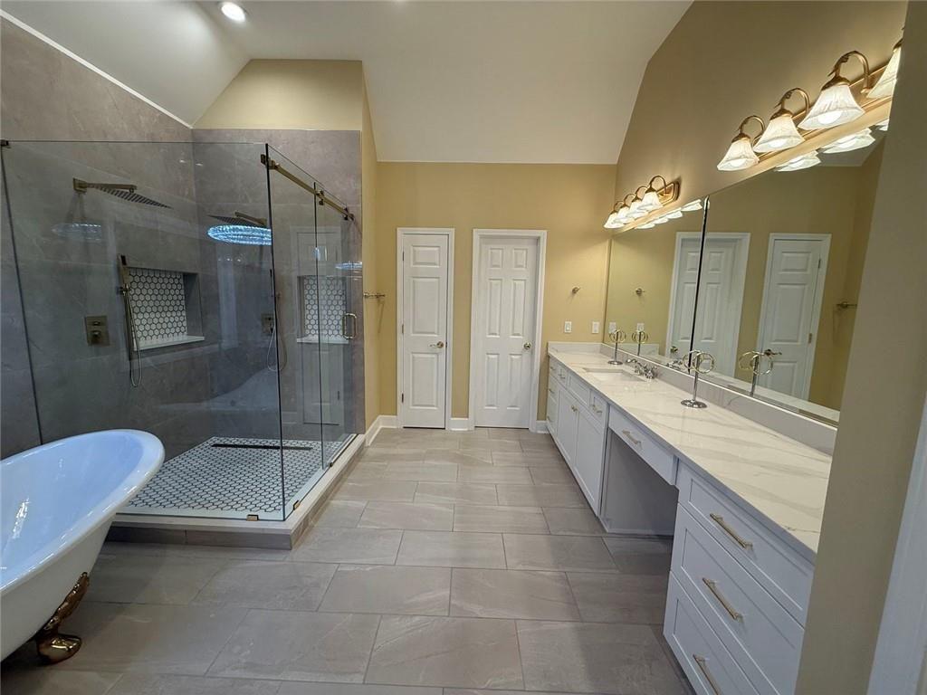 3316 Keenland Road Marietta, GA 30062 - Photo 15 of 54 a bathroom with a double vanity sink mirror and shower