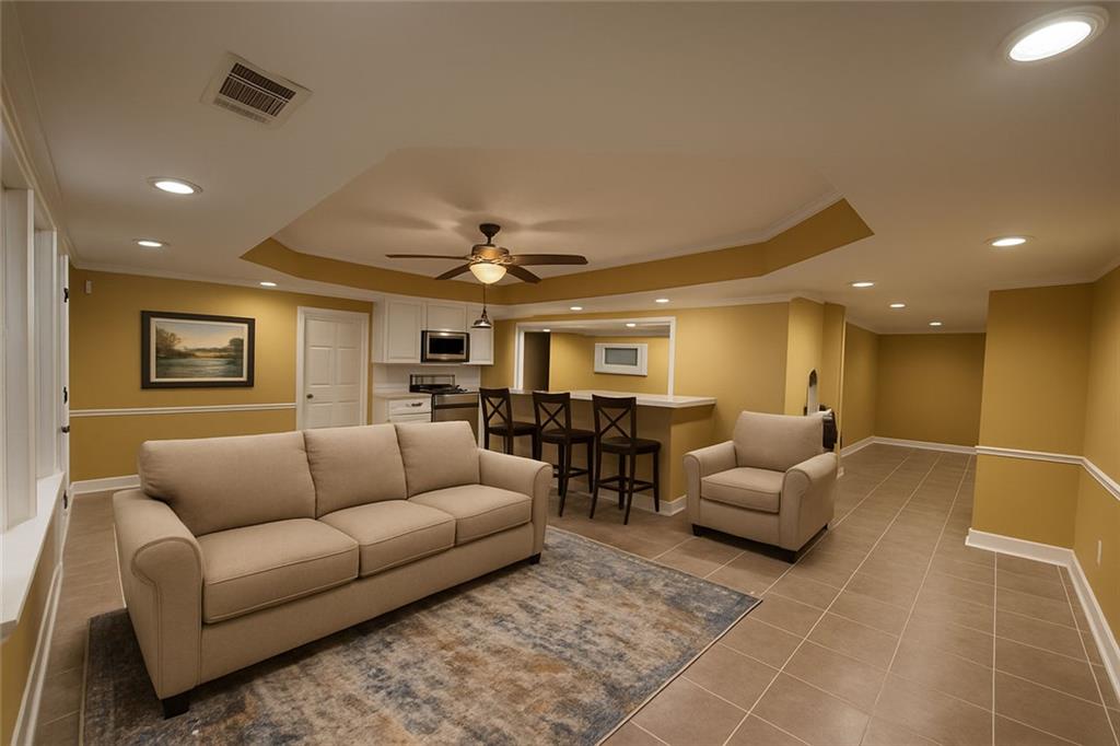 3316 Keenland Road Marietta, GA 30062 - Photo 32 of 54 a living room with furniture and a potted plant