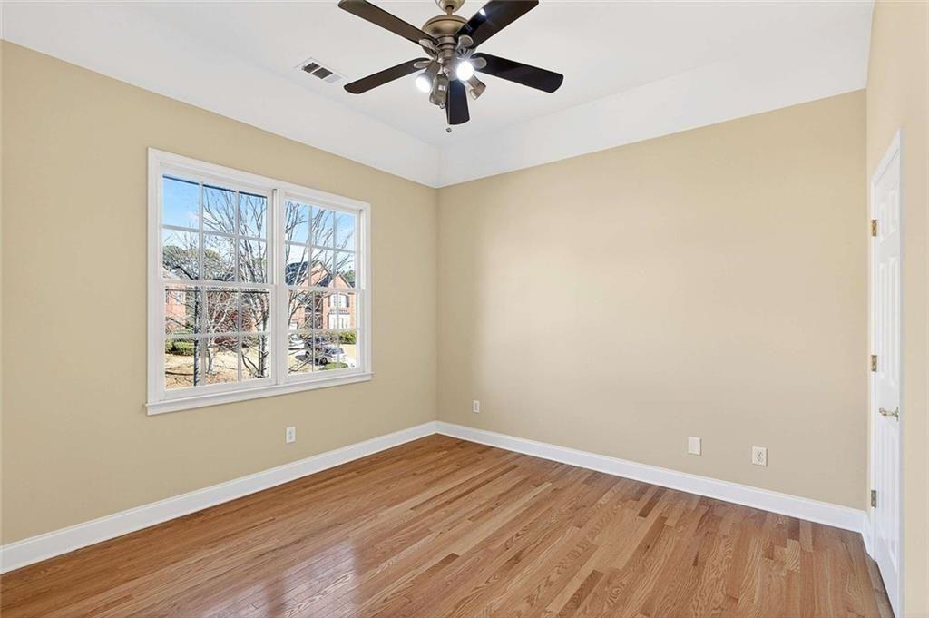 3316 Keenland Road Marietta, GA 30062 - Photo 33 of 57 a view of an empty room with wooden floor and a window