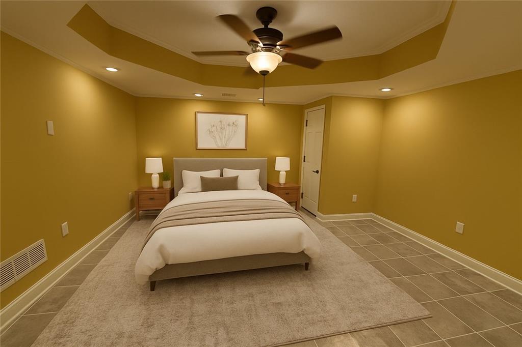 3316 Keenland Road Marietta, GA 30062 - Photo 40 of 54 a bedroom with a bed and a ceiling fan