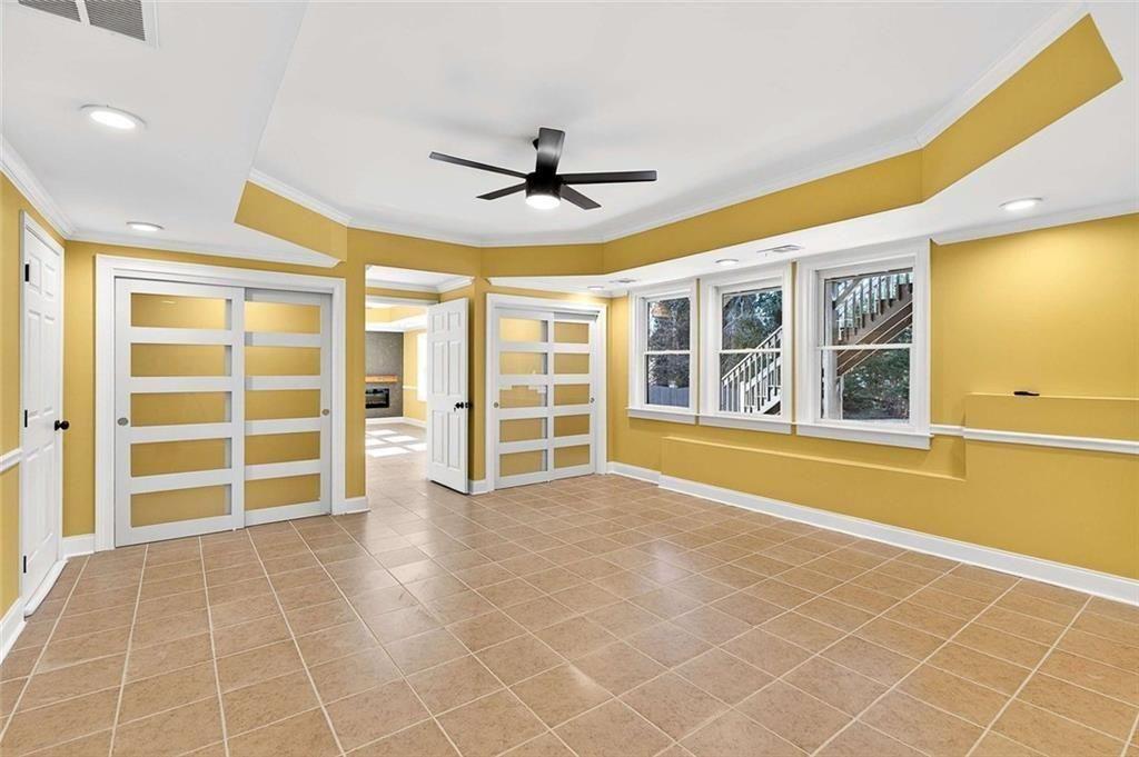 3316 Keenland Road Marietta, GA 30062 - Photo 41 of 57 a view of an empty room with a window and cabinet