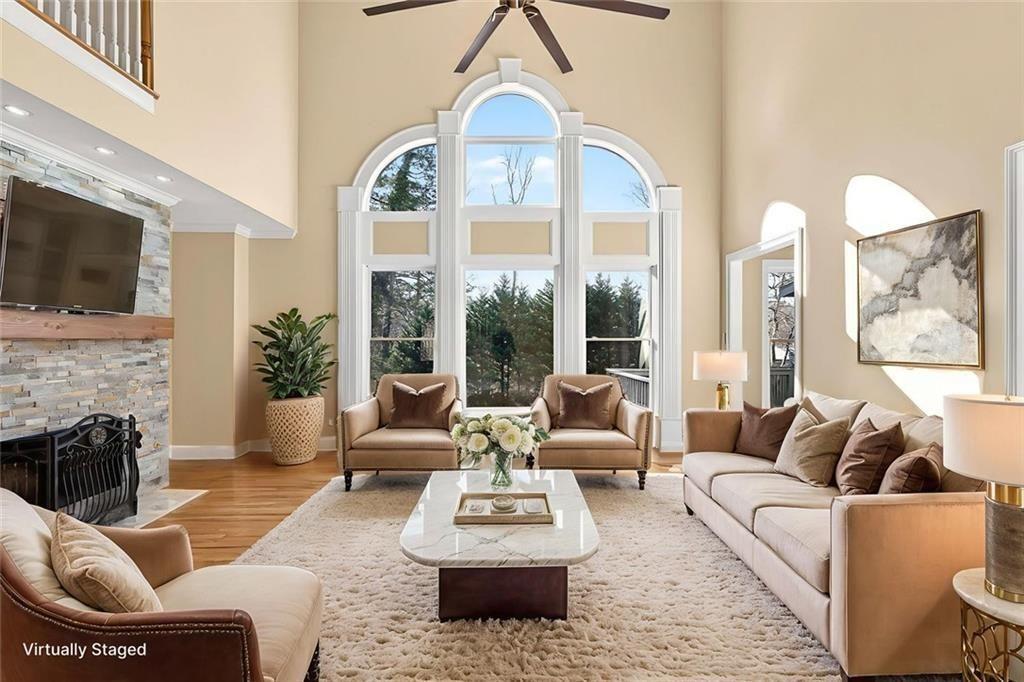 3316 Keenland Road Marietta, GA 30062 - Photo 5 of 57 a living room with furniture fireplace and flat screen tv
