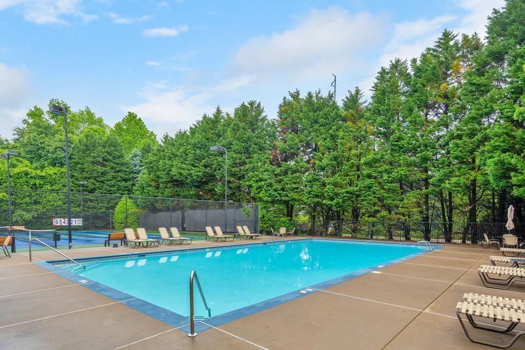 3316 Keenland Road Marietta, GA 30062 - Photo 51 of 54 a view of a swimming pool with a patio and a yard