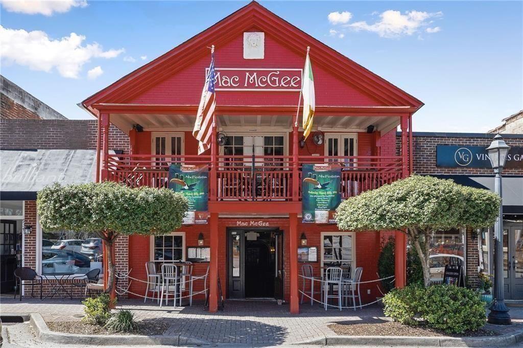 3316 Keenland Road Marietta, GA 30062 - Photo 57 of 57 a view of a cafe with a table and chairs under an umbrella