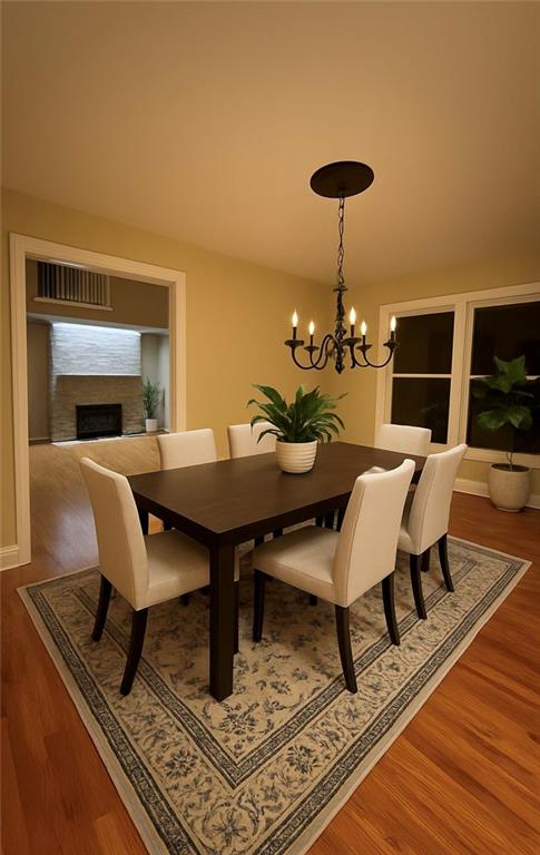 3316 Keenland Road Marietta, GA 30062 - Photo 6 of 54 a dining room with a table and chairs