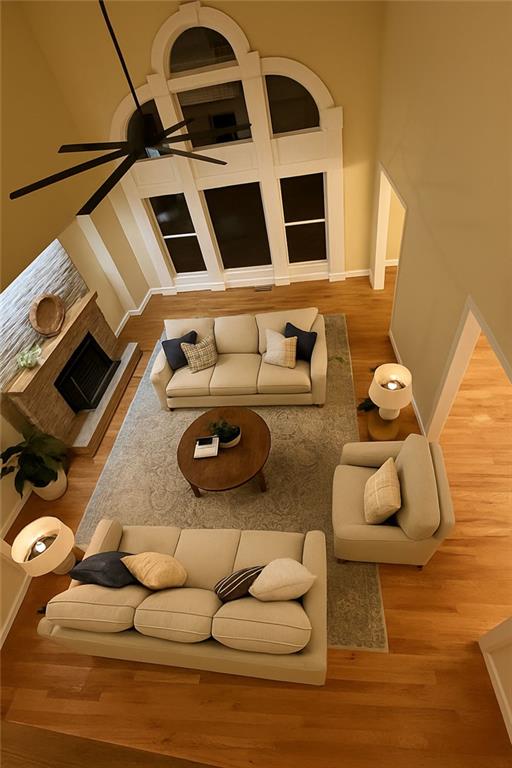 3316 Keenland Road Marietta, GA 30062 - Photo 7 of 54 a living room with couches and a fireplace with wooden floor
