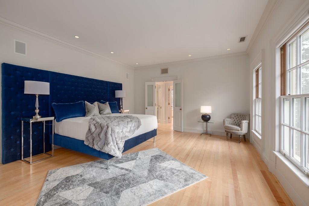 11 Cramond Road Brookline, MA 02467 - Photo 13 of 41 a bedroom with a bed and a chandelier