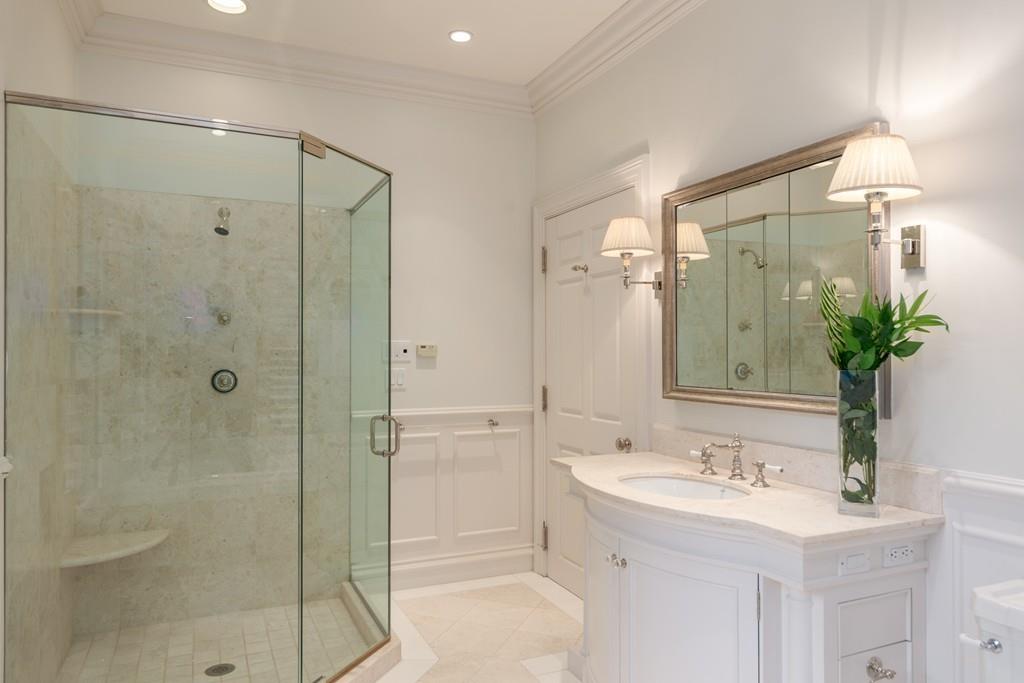 11 Cramond Road Brookline, MA 02467 - Photo 16 of 41 a bathroom with a shower sink and mirror