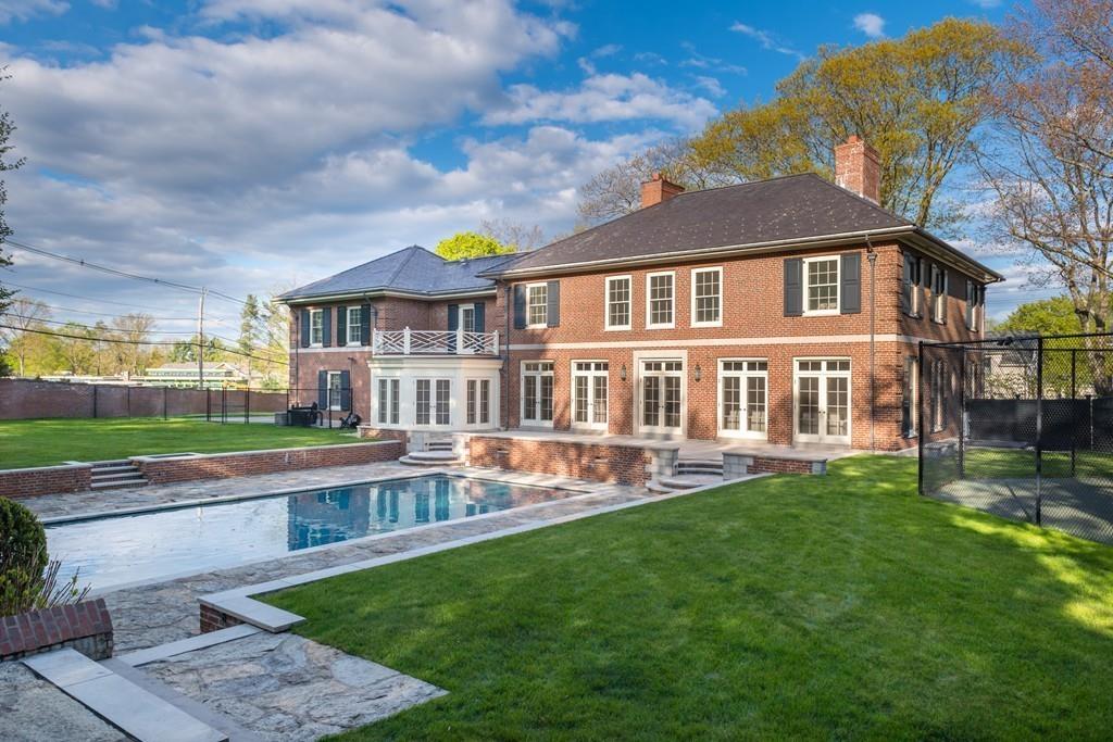 11 Cramond Road Brookline, MA 02467 - Photo 26 of 41 a front view of a house with a yard table and chairs
