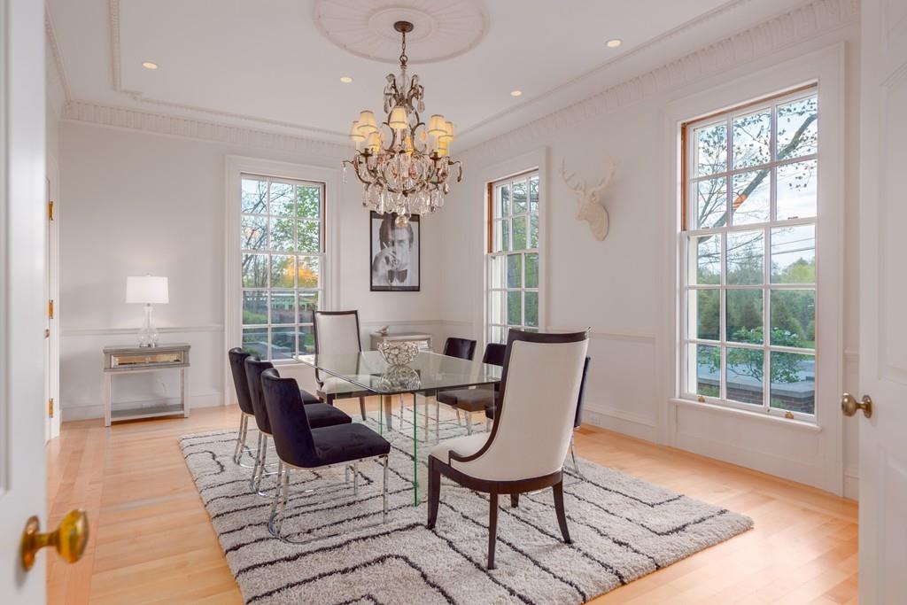 11 Cramond Road Brookline, MA 02467 - Photo 6 of 41 a view of a dining room with furniture a chandelier and wooden floor
