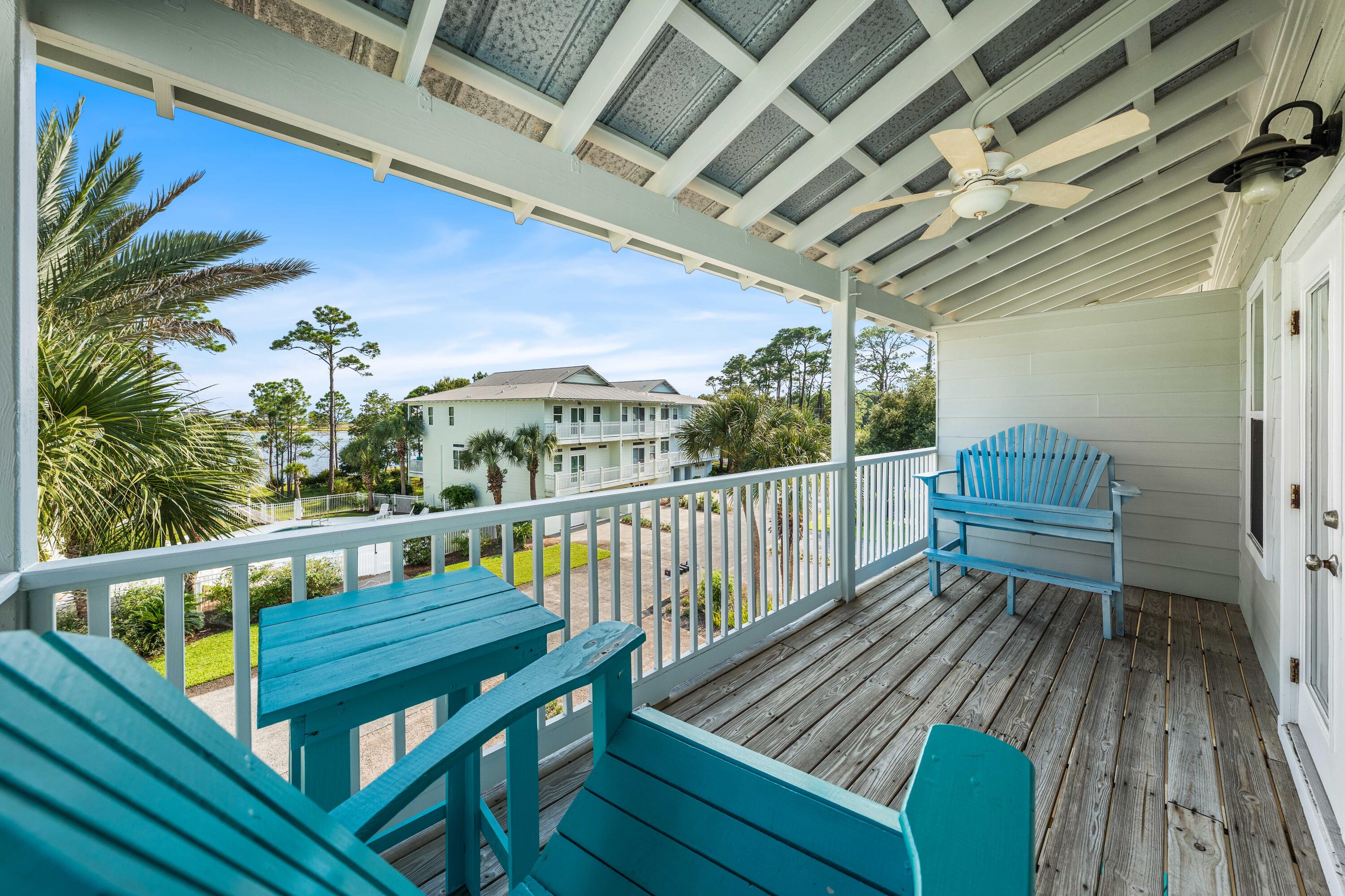 33 Dune Breeze Lane, Unit H2 Santa Rosa Beach, FL 32459 - Photo 14 of 54 a roof deck with wooden floor and outdoor seating