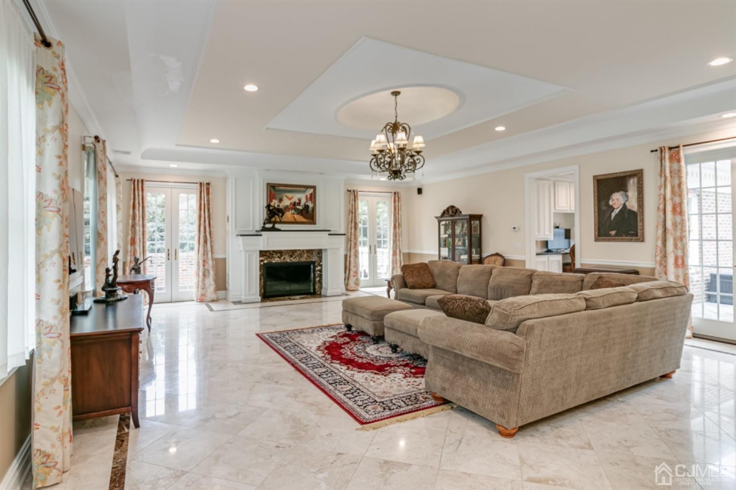 4 Longview Road Edison, NJ 08820 - Photo 16 of 47 a living room with furniture and a chandelier