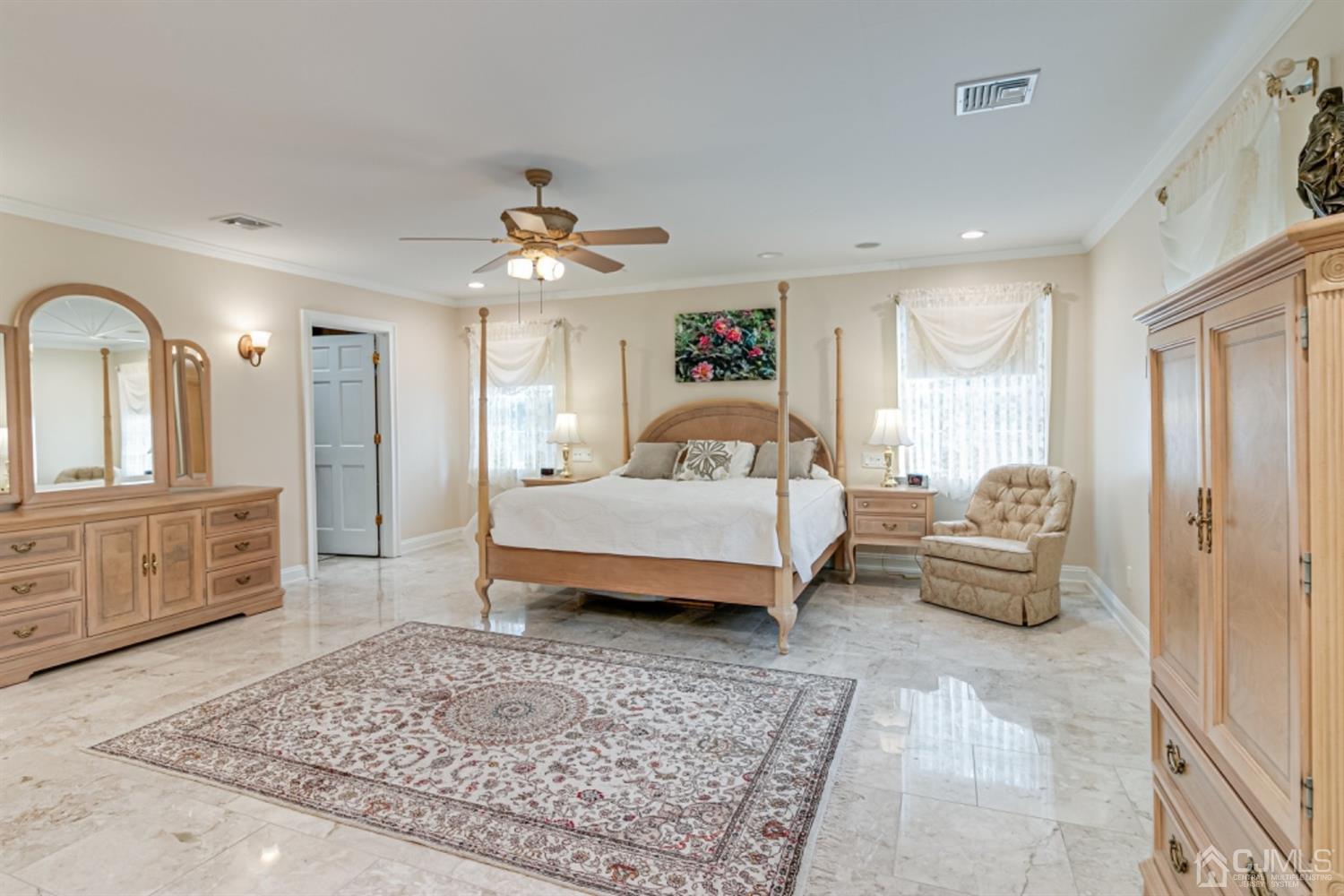 4 Longview Road Edison, NJ 08820 - Photo 19 of 47 a spacious bedroom with a bed a couch and dresser