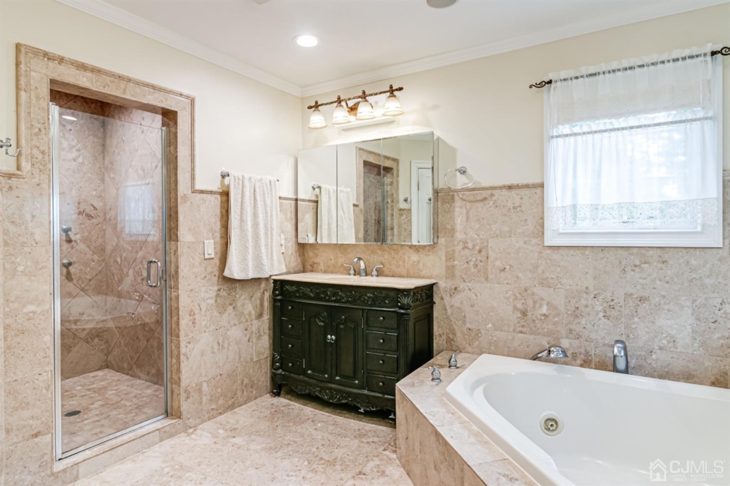 4 Longview Road Edison, NJ 08820 - Photo 20 of 47 a spacious bathroom with a tub sink shower and mirror