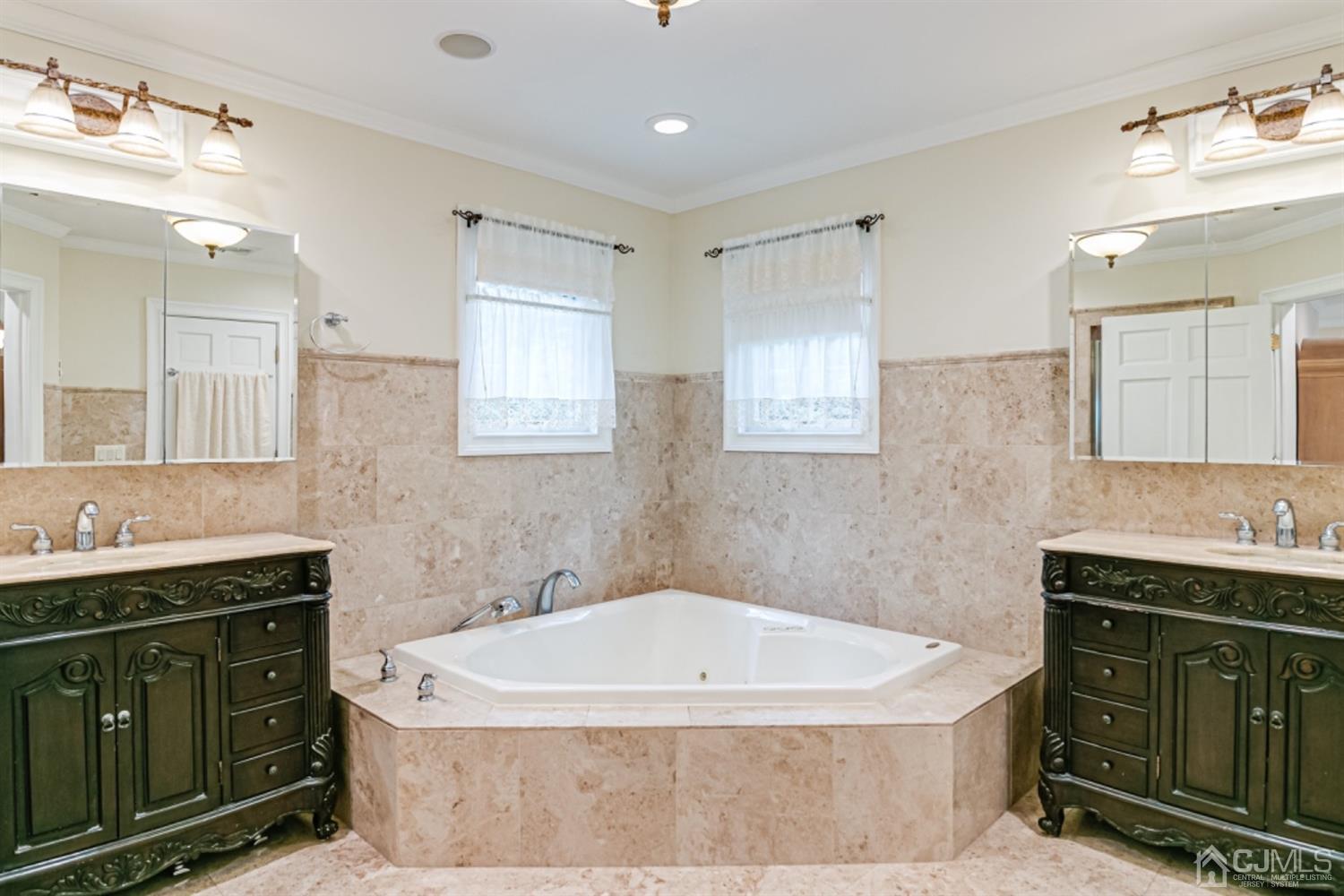 4 Longview Road Edison, NJ 08820 - Photo 21 of 47 a bathroom with a bathtub sink double vanity and mirror