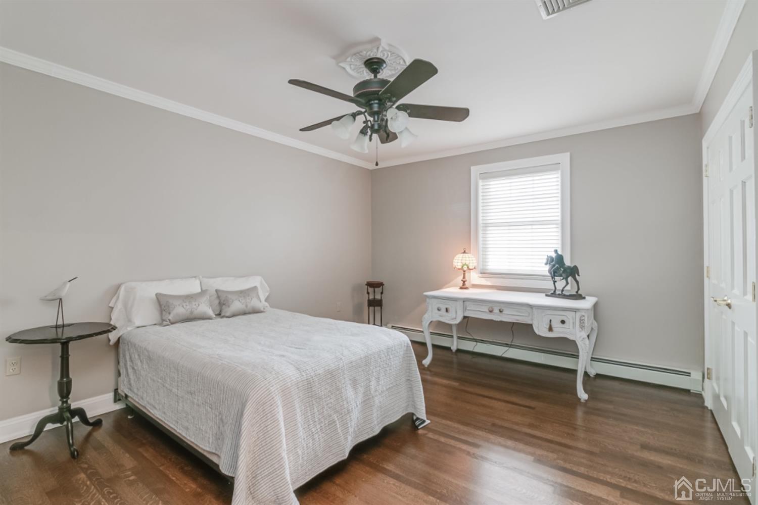 4 Longview Road Edison, NJ 08820 - Photo 26 of 47 a bedroom with a bed and a table in it