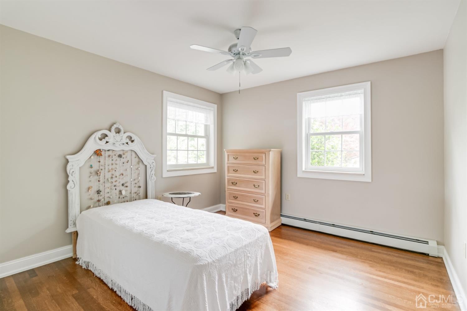 4 Longview Road Edison, NJ 08820 - Photo 28 of 47 a bedroom with a large bed and a window