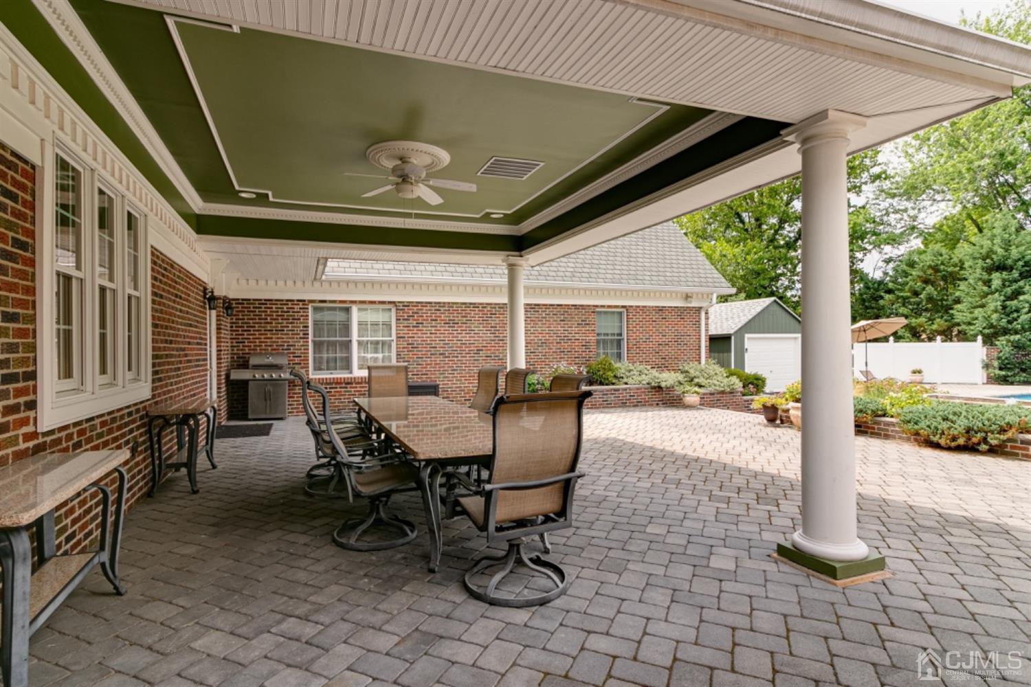 4 Longview Road Edison, NJ 08820 - Photo 34 of 47 a view of a patio with table and chairs and potted plants