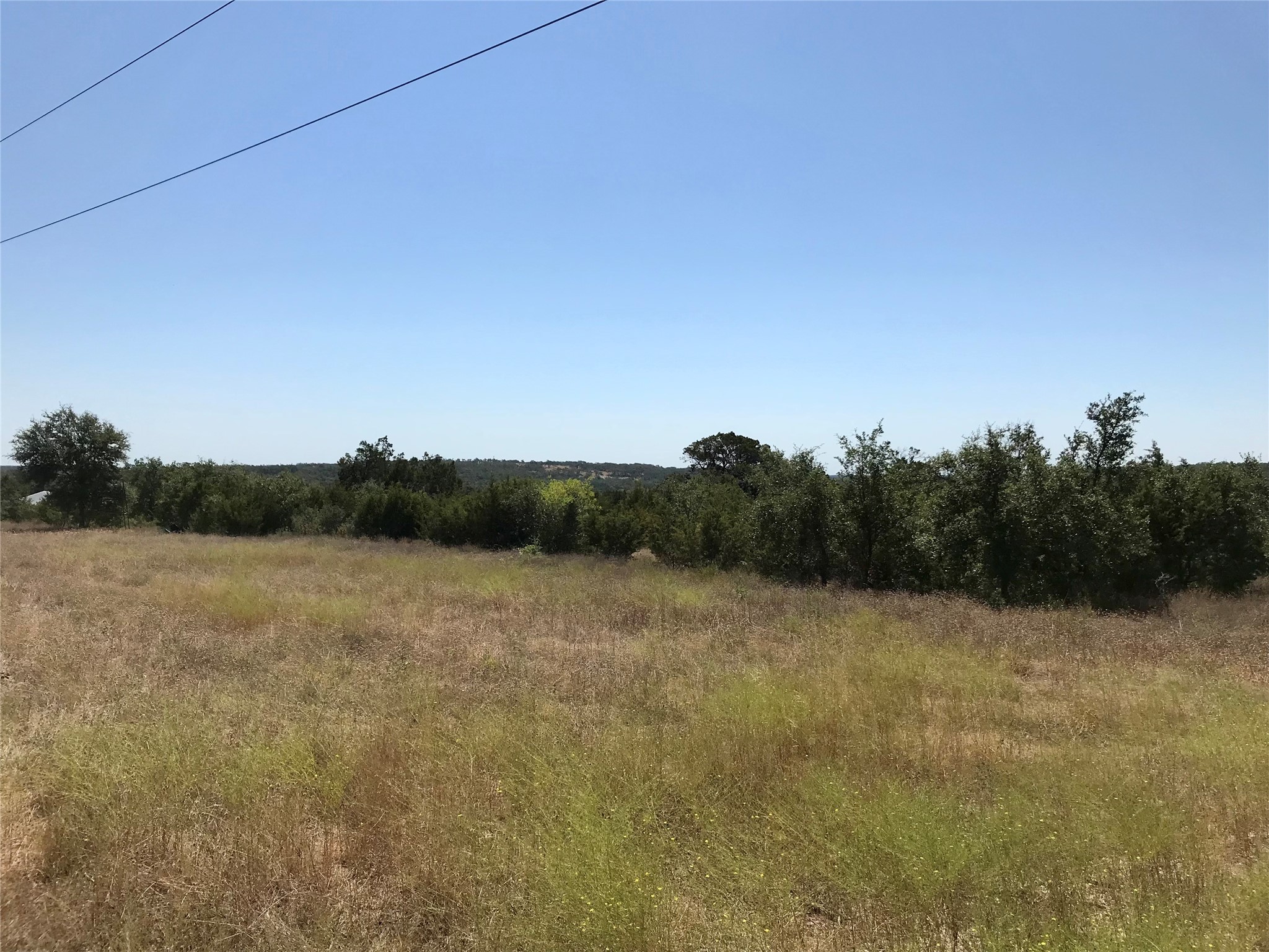 970 B Rr 32 San Marcos, TX 78666 - Photo 17 of 30 A terrace at the upper portion of the property. The utility easement crosses the very back of the land.