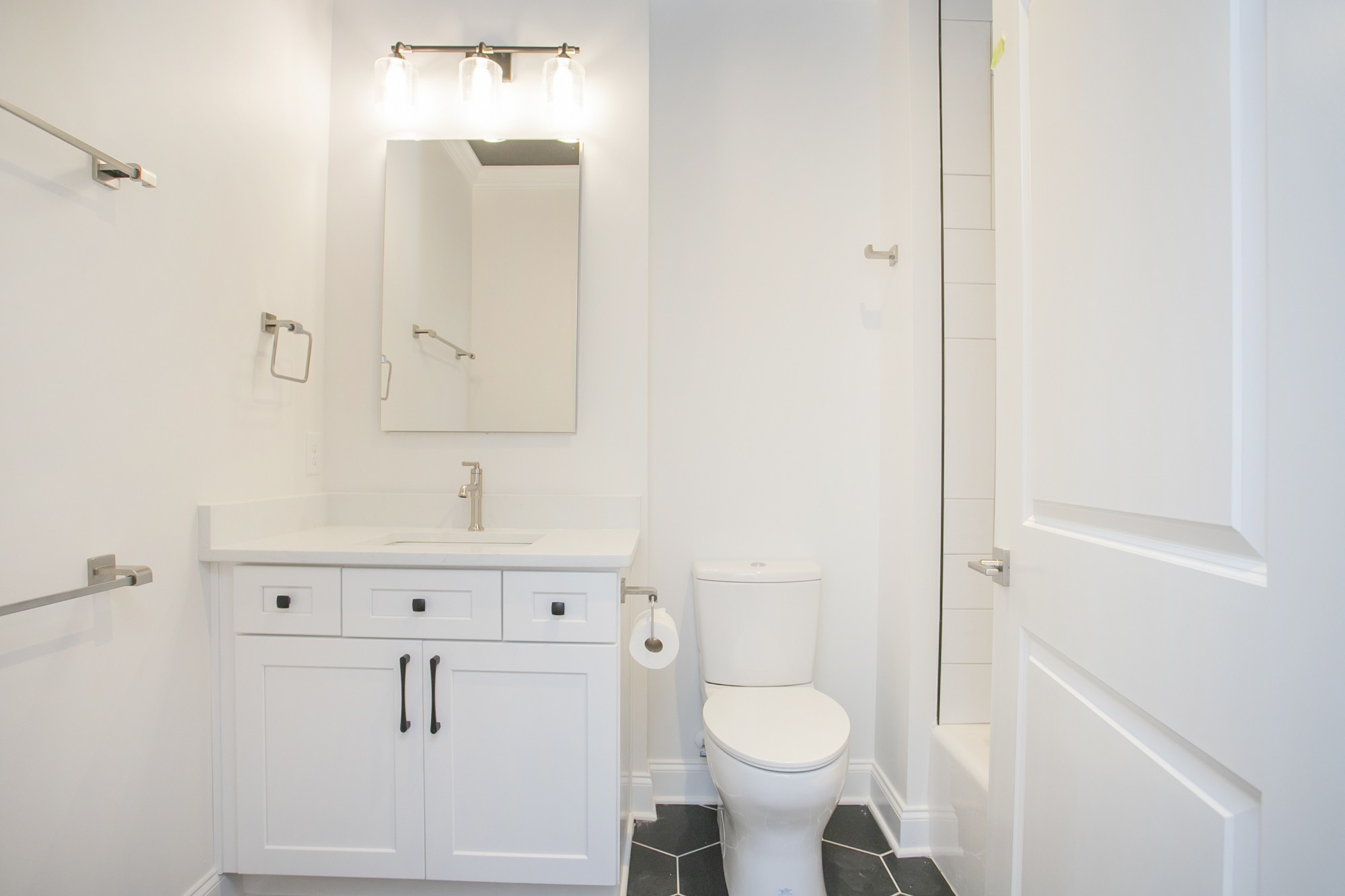 1530 Shalom Street Murfreesboro, TN 37128 - Photo 14 of 20 a bathroom with a sink a toilet and vanity