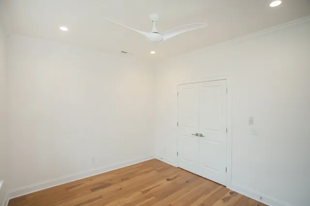 a view of room with wooden floor