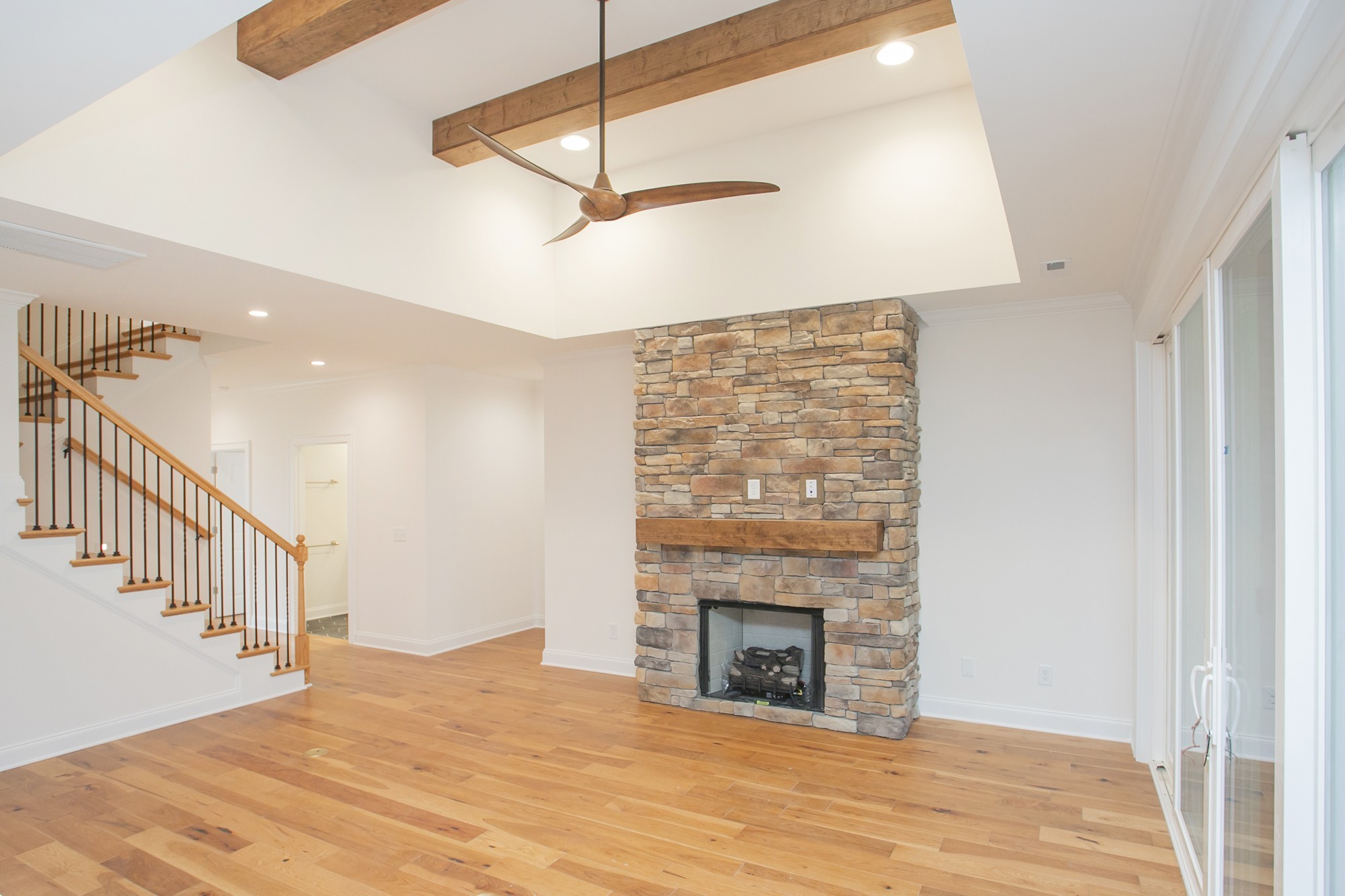 1530 Shalom Street Murfreesboro, TN 37128 - Photo 3 of 20 a view of empty room with fireplace and fan
