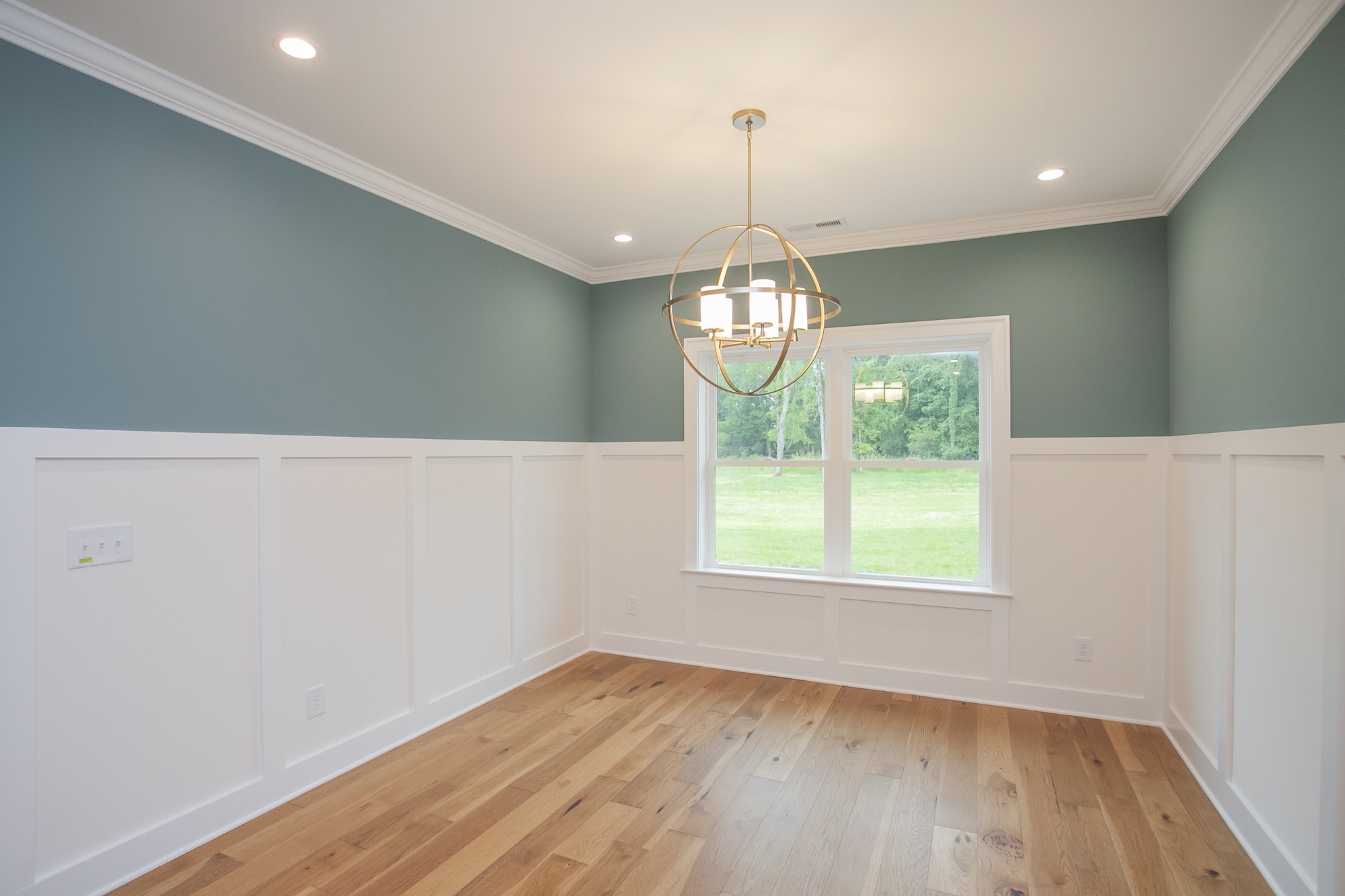 1530 Shalom Street Murfreesboro, TN 37128 - Photo 8 of 20 a view of an empty room with wooden floor and a window
