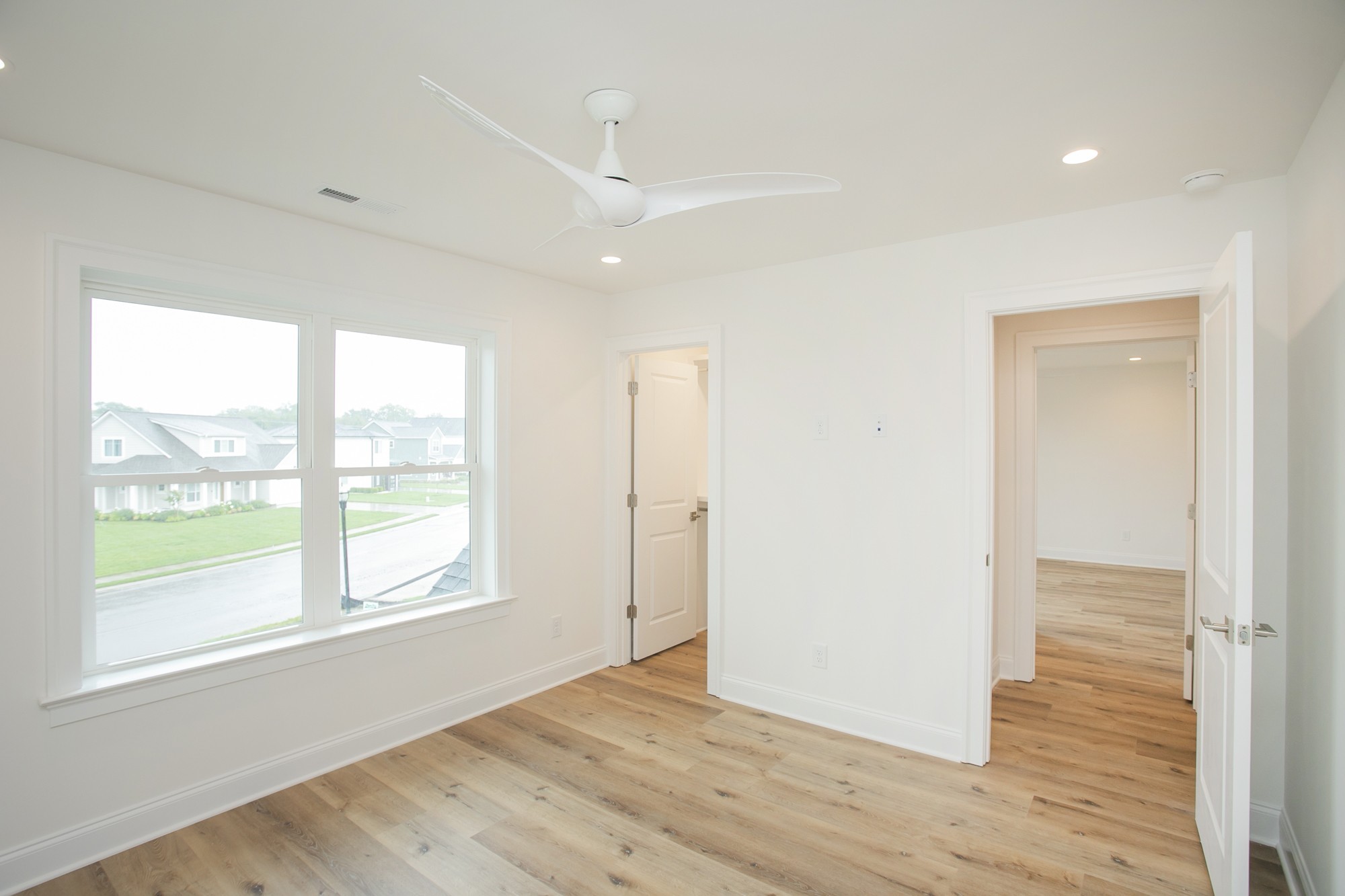 1530 Shalom Street Murfreesboro, TN 37128 - Photo 9 of 20 a view of an empty room with wooden floor and a window