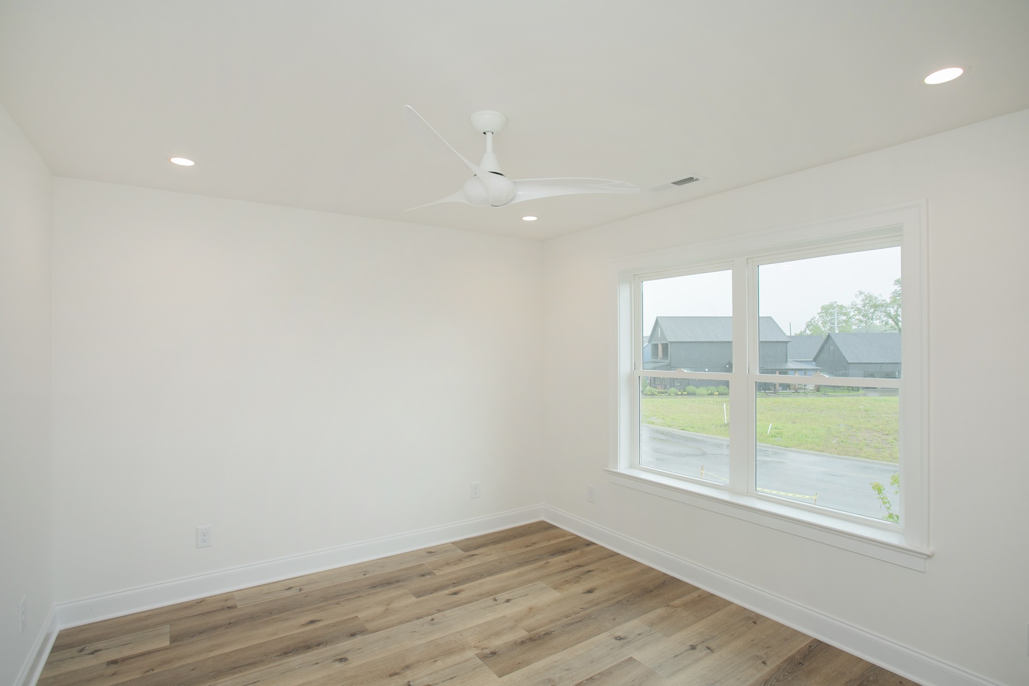1530 Shalom Street Murfreesboro, TN 37128 - Photo 10 of 20 an empty room with wooden floor and a window
