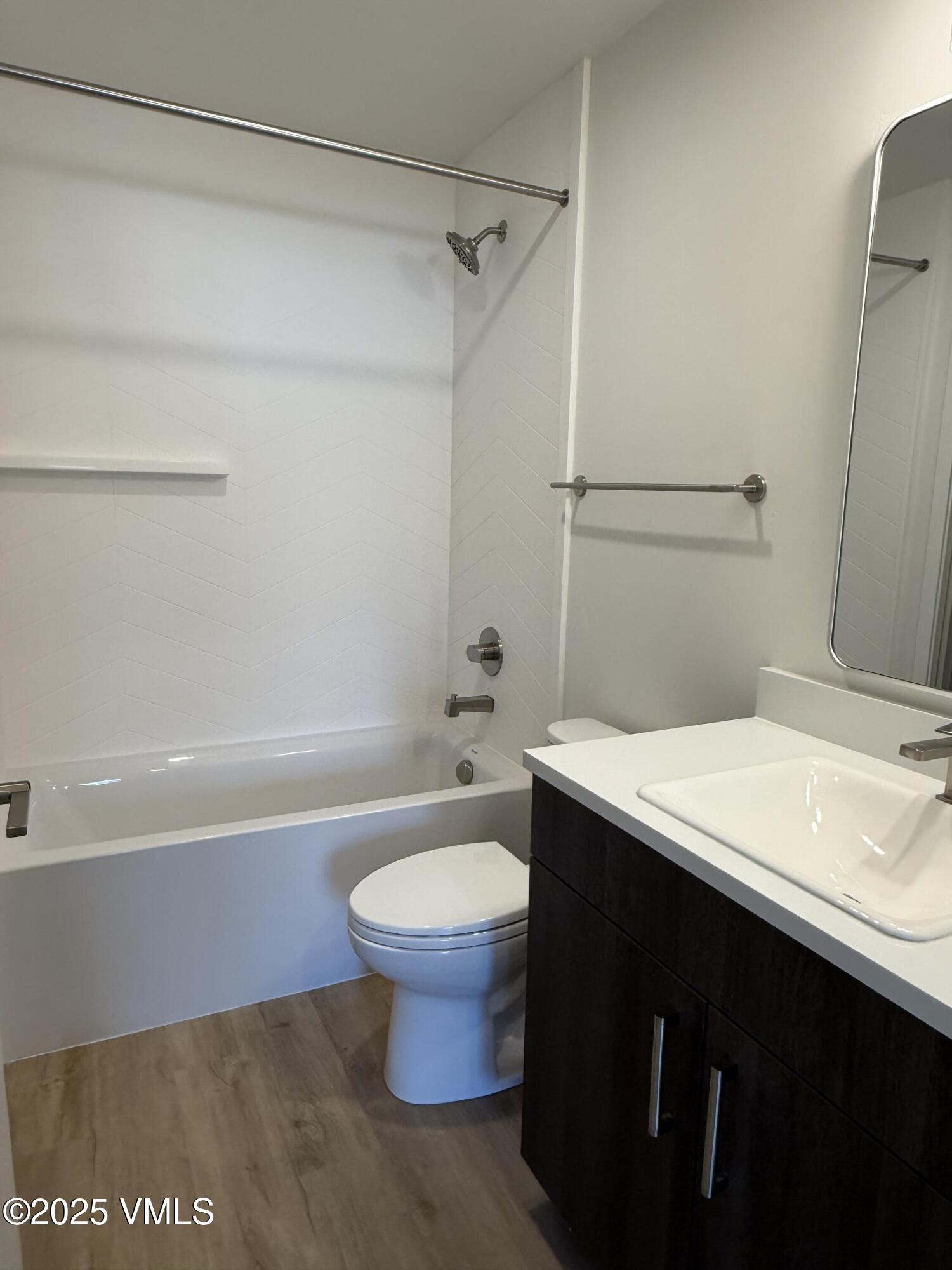 91 Mount Hope Circle, Unit G301 Eagle, CO 81631 - Photo 11 of 13 a bathroom with a sink a toilet and shower