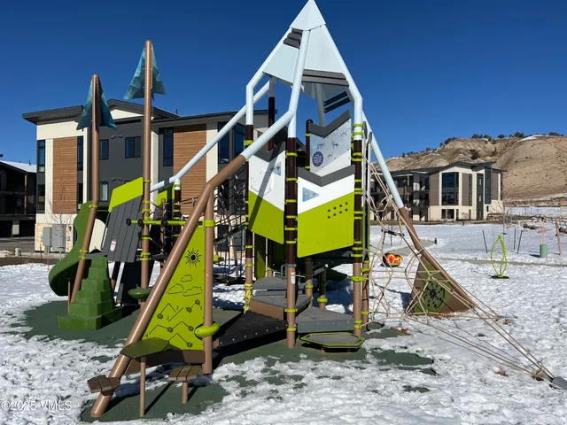 a view of a park with a slide